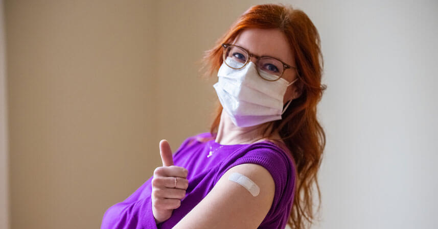 Happy woman after getting the COVID-19 vaccine