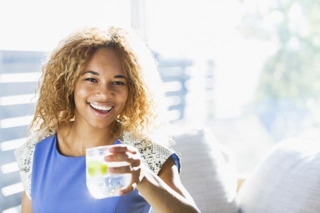 woman holding a cup of water