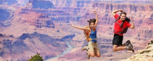 People jumping at the Grand Canyon